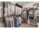 Walk-in closet features built-in shelving and hanging rods for ample storage space at 10438 Skye Arroyo Ave, Las Vegas, NV 89166