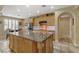 Island kitchen featuring granite countertops and modern appliances at 1272 Olivia Pkwy, Henderson, NV 89011