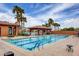 Stunning community pool with lane markers and surrounding shaded cabanas at 1272 Olivia Pkwy, Henderson, NV 89011