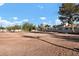 Wide shot of community common area with sparse trees on a sunny day at 1316 Driscoll Dr # 102, Las Vegas, NV 89128