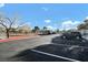 RV parking area with ample spaces, additional parking, and surrounding trees at 1316 Driscoll Dr # 102, Las Vegas, NV 89128