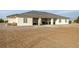 Spacious backyard with a covered patio area, perfect for outdoor living at 1601 W Calvada Blvd, Pahrump, NV 89048