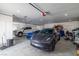 Spacious three-car garage with multiple vehicles and ample storage space at 1601 W Calvada Blvd, Pahrump, NV 89048