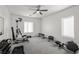 Spacious gym featuring fitness equipment, ceiling fan, and neutral carpet at 1601 W Calvada Blvd, Pahrump, NV 89048