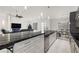 Bright kitchen with a marble island and open floor plan, seamlessly connecting to living and dining areas at 1601 W Calvada Blvd, Pahrump, NV 89048