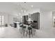 Spacious kitchen featuring a marble waterfall island and modern gray cabinetry at 1601 W Calvada Blvd, Pahrump, NV 89048