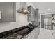 Modern kitchen featuring stainless steel appliances, granite counters, and a modern vent hood at 1601 W Calvada Blvd, Pahrump, NV 89048