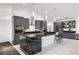 Gorgeous kitchen features dark gray cabinetry, recessed lighting, white walls, and stainless steel appliances at 1601 W Calvada Blvd, Pahrump, NV 89048