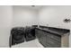 Functional laundry room featuring modern appliances, a sink, and sleek countertops at 1601 W Calvada Blvd, Pahrump, NV 89048