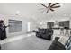 Open-concept living area boasts recessed lighting, tile floors, and a view of the dining and kitchen area at 1601 W Calvada Blvd, Pahrump, NV 89048