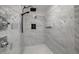 Modern walk-in shower with marble tile, rainfall shower head, and built-in niche at 1601 W Calvada Blvd, Pahrump, NV 89048