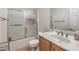 Bright bathroom with a combined shower and tub featuring a frosted glass sliding door at 172 Turtle Ridge Ave, Las Vegas, NV 89183