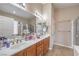 Bathroom features a double sink vanity, large mirror, and a separate shower at 172 Turtle Ridge Ave, Las Vegas, NV 89183