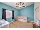 Bedroom showcasing a window, desk, and accent wall with light purple daybed at 172 Turtle Ridge Ave, Las Vegas, NV 89183
