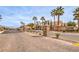 Gated entrance to Glenbrook Estates featuring desert landscaping and paved brick streets at 172 Turtle Ridge Ave, Las Vegas, NV 89183