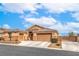 Inviting single-Gathering home featuring a well-kept lawn and a driveway leading to a two-car garage at 172 Turtle Ridge Ave, Las Vegas, NV 89183