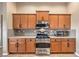 A chef-ready kitchen with stainless steel appliances and tons of wooden cabinets for storage at 172 Turtle Ridge Ave, Las Vegas, NV 89183