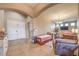 Open concept living area boasts tile floors, with a dining area and seating area, with archways and neutral walls at 172 Turtle Ridge Ave, Las Vegas, NV 89183