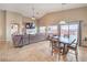 Spacious living room with an open layout, connecting to a dining area and offering outdoor views at 172 Turtle Ridge Ave, Las Vegas, NV 89183