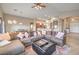 Spacious living room with comfortable seating, a large sectional sofa and carpet at 172 Turtle Ridge Ave, Las Vegas, NV 89183