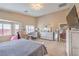 Large main bedroom featuring a workstation, dresser, and ample natural light at 172 Turtle Ridge Ave, Las Vegas, NV 89183