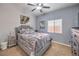 Bedroom featuring a bed, ceiling fan, window and neutral walls and flooring at 172 Turtle Ridge Ave, Las Vegas, NV 89183