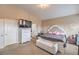 Cozy main bedroom with a tufted headboard, dresser, and neutral tones at 172 Turtle Ridge Ave, Las Vegas, NV 89183