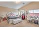 Serene main bedroom with a comfortable bed, sitting area, and ample natural light at 172 Turtle Ridge Ave, Las Vegas, NV 89183