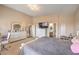Bright main bedroom with a dresser, ensuite bathroom, and comfortable bedding at 172 Turtle Ridge Ave, Las Vegas, NV 89183