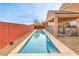 Backyard swimming pool, a great escape from the summer heat, surrounded by desert landscape at 172 Turtle Ridge Ave, Las Vegas, NV 89183