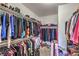 A very large walk-in closet with rows of hanging clothes and plenty of storage space at 172 Turtle Ridge Ave, Las Vegas, NV 89183