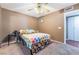 Bedroom featuring carpet, ceiling fan, bed, and closet with sliding doors at 1851 Hillpointe Rd # 2912, Henderson, NV 89074