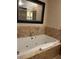 Bathroom featuring a marble-surround bathtub with jacuzzi jets and hotel towel at 2000 N Fashion Show Dr # 1728, Las Vegas, NV 89109