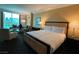 Comfortable hotel bedroom showcasing a plush king bed and sitting area with panoramic city views at 2000 N Fashion Show Dr # 1728, Las Vegas, NV 89109