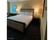 The cozy bedroom includes a neatly made bed, a nightstand, and a desk setup at 2000 N Fashion Show Dr # 1728, Las Vegas, NV 89109