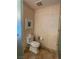 A well-maintained toilet sits beneath framed artwork, combining functionality with simple style at 2000 N Fashion Show Dr # 1728, Las Vegas, NV 89109