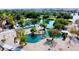 Scenic aerial view of community park featuring tranquil lakes, lush landscaping, walking paths, and recreational spaces at 2212 Barton Mill Ct, North Las Vegas, NV 89084