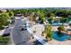 Aerial shot of a picturesque park with walking paths, lakes, playgrounds, mature trees, and community amenities at 2212 Barton Mill Ct, North Las Vegas, NV 89084