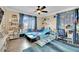 Themed bedroom with blue accents, unique furnishings and hardwood flooring at 2212 Barton Mill Ct, North Las Vegas, NV 89084