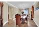 Elegant dining room features a chandelier, large windows and beautiful tile flooring at 2212 Barton Mill Ct, North Las Vegas, NV 89084