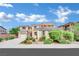 Inviting two-story home with a well-manicured front yard and attached garage at 2212 Barton Mill Ct, North Las Vegas, NV 89084