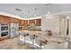 Well-lit kitchen featuring granite countertop island, stainless steel appliances, and pendant lighting at 2212 Barton Mill Ct, North Las Vegas, NV 89084