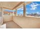 Covered patio featuring stone columns and an outdoor view of neighboring properties at 2212 Barton Mill Ct, North Las Vegas, NV 89084