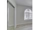 Bedroom featuring a large window, light hardwood flooring, and mirrored closet doors at 2251 Wigwam Pkwy # 716, Henderson, NV 89074