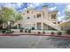 Condominium exterior with desert landscaping, a stairway, and a blue sky with clouds at 2251 Wigwam Pkwy # 716, Henderson, NV 89074