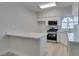 Modern kitchen with stainless steel appliances, white cabinets and quartz countertops at 2251 Wigwam Pkwy # 716, Henderson, NV 89074