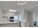 Bright kitchen with stainless steel appliances, white cabinetry, and quartz countertops at 2251 Wigwam Pkwy # 716, Henderson, NV 89074
