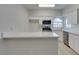 Kitchen with stainless steel appliances, white cabinetry, and quartz countertops at 2251 Wigwam Pkwy # 716, Henderson, NV 89074