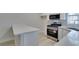 Bright kitchen with stainless steel appliances, gas range, and quartz countertops at 2251 Wigwam Pkwy # 716, Henderson, NV 89074