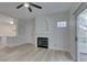 Bright living room with a fireplace and new flooring, flowing to an open kitchen concept at 2251 Wigwam Pkwy # 716, Henderson, NV 89074